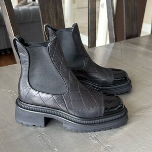 Chanel black leather quilted patent ankle boot bootie lug sole gold logo sz 39